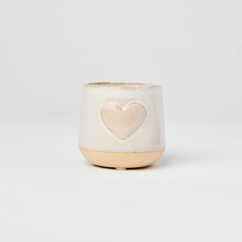 Ceramic planter with a pink heart