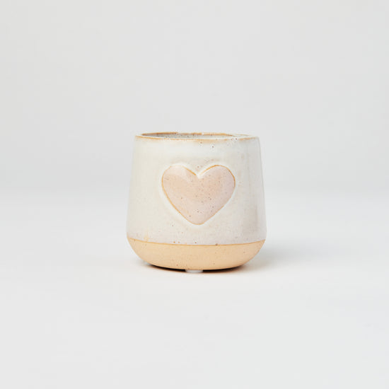 Ceramic planter with a pink heart